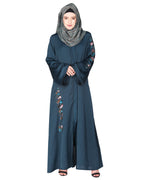 Opulent hand embroidered front open abaya with a unique twisted motif of sparkling sequins Bottle Green