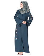 Opulent hand embroidered front open abaya with a unique twisted motif of sparkling sequins Bottle Green